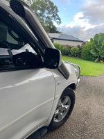 A-pillar view of Canna Fabrication stainless twin snorkels on a white Toyota LandCruiser 200 Series