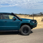 Green Volkswagen Amarok rear three-quarter view with Canna Fabrication stainless snorkel