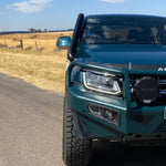 Front close-up of a green Volkswagen Amarok with Canna Fabrication short-entry snorkel