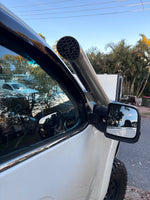 Canna Fabrication teardrop snorkel next to the mirror on a Nissan Navara NP300