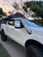 White Nissan Navara NP300 with roof rack and Canna Fabrication 4.5 inch teardrop snorkel — rear three-quarter view