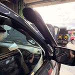 Close-up of the Canna Fabrication stainless snorkel beside the mirror on an Isuzu D-MAX