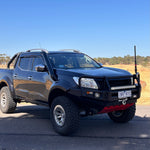 Black Nissan Navara NP300 with bullbar and Canna Fabrication brushed-silver short-entry snorkel — front three-quarter view