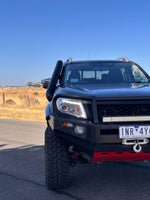 Black Nissan Navara NP300 front view with Canna Fabrication short-entry stainless snorkel fitted