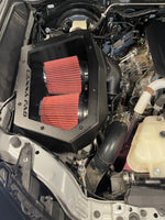 Canna Fabrication Hilux N90 twin pod filter airbox with red filters — engine bay detail