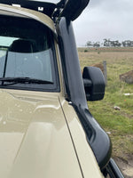 Close-up of one snorkel from the Canna Fabrication 5 inch twin set on a LandCruiser 70 Series