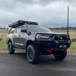 Grey Toyota Hilux N80 tourer with rooftop tent and Canna Fabrication short-entry stainless snorkel