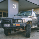 Toyota Hilux LN106 4" Long-Entry Stainless Snorkel by Canna Fabrication — brushed silver