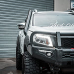 Canna Fabrication brushed-silver short-entry snorkel and bullbar fitted to a white 4WD ute in the Melbourne workshop