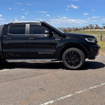 Black Ford Ranger PX Wildtrak with Canna Fabrication brushed-silver short-entry snorkel — driver-side profile